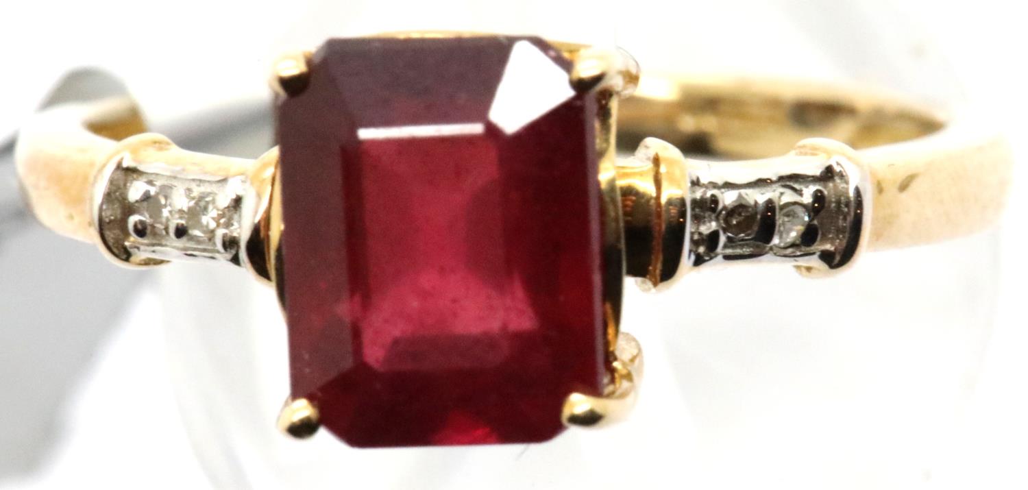 9ct gold emerald cut ruby ring with diamond shoulders, size S/T, 3.1g. P&P Group 1 (£14+VAT for