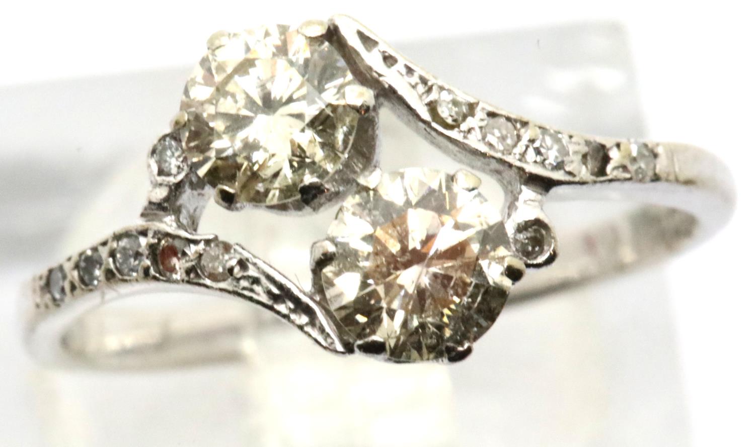 Vintage 1920s 18ct white gold diamond engagement ring, the crossover set champagne coloured stones