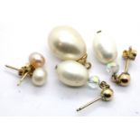 Two pairs of pearl mounted presumed gold studs and a yellow metal mounted pearl pendant. P&P Group 1