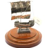 Sterling silver ship of Kyrenia, mounted on a turned plinth, H: 10 cm. P&P Group 1 (£14+VAT for