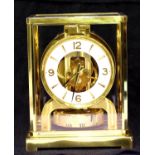 Brass cased Jaeger Le Coultre Atmos clock, the case and glass in good condition, runs then stops.