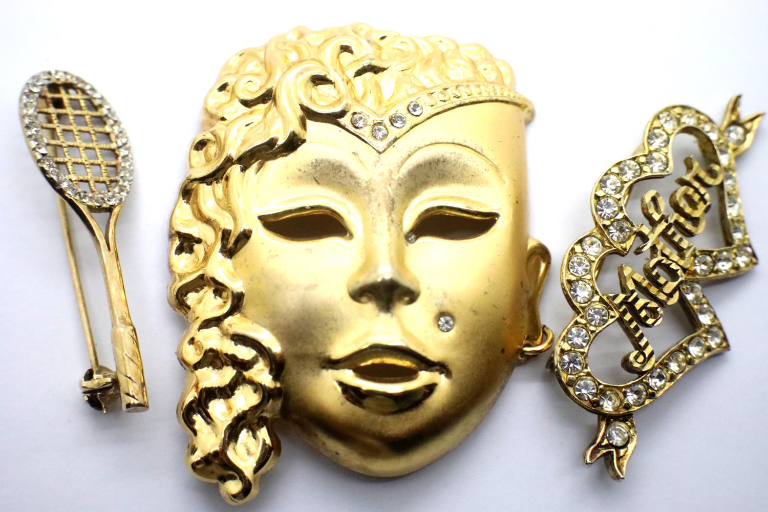 Three presumed 925 silver and gilt brooches; Face, Tennis, and Mother. Total weight 20.5g. P&P Group