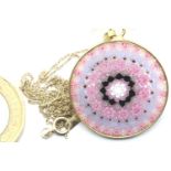 Circular millefiori pendant in a yellow metal mount, on a 9ct gold chain. P&P Group 1 (£14+VAT for