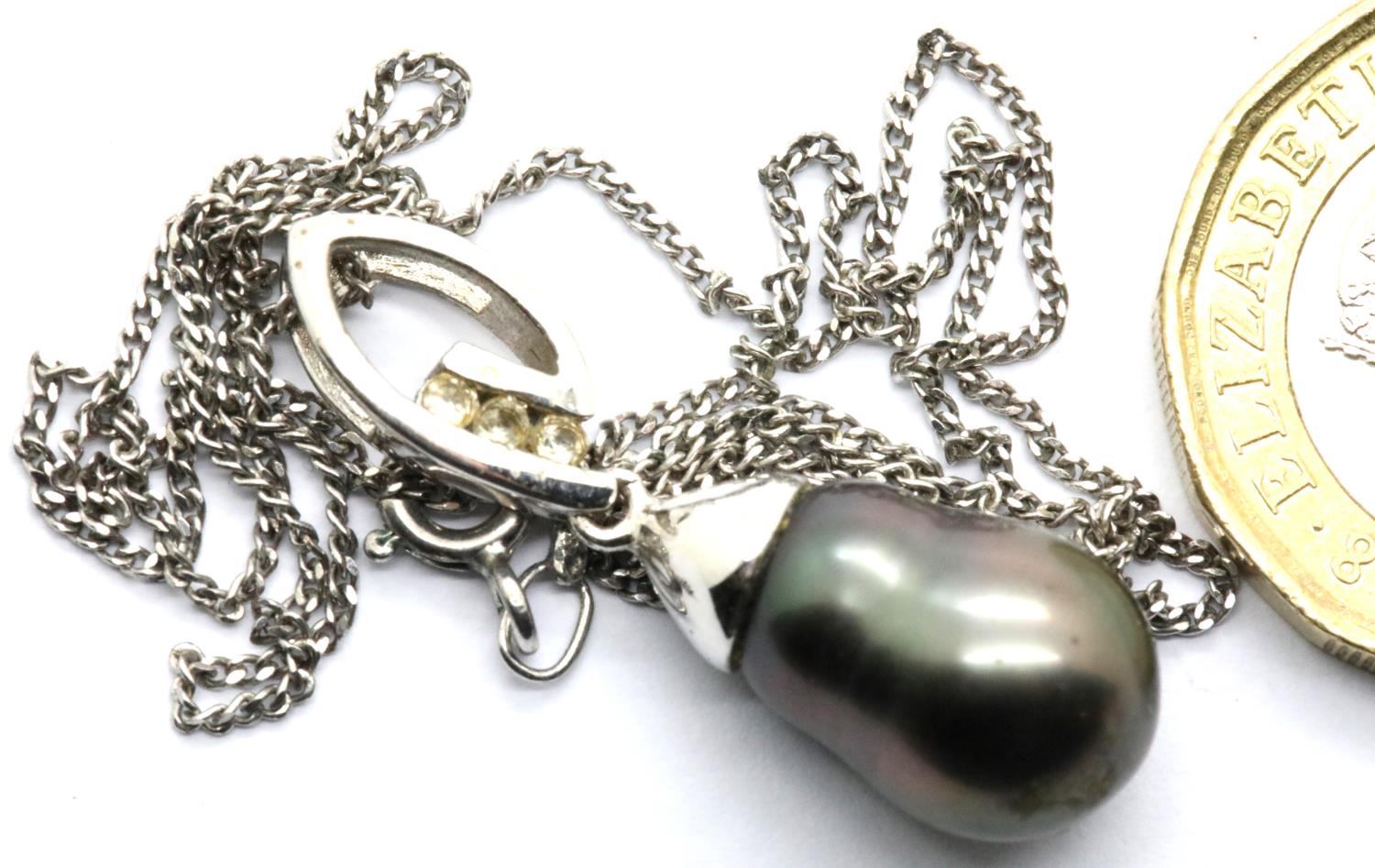 Contemporary Baroque pearl and stone set silver pendant on a silver chain. Pendant L: 2 cm, chain L: