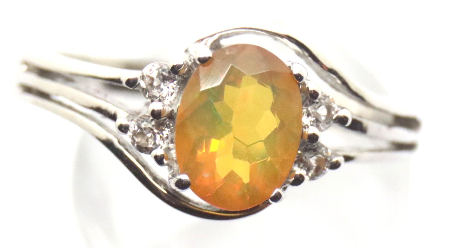 Sterling silver ring set with an Ethiopian opal and diamonds. Size S, 3.5g. P&P Group 1 (£14+VAT for