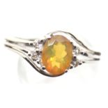 Sterling silver ring set with an Ethiopian opal and diamonds. Size S, 3.5g. P&P Group 1 (£14+VAT for