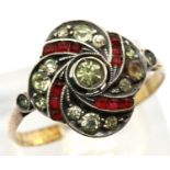 Yellow metal ring set with red and white stones. 2.6g. size Z. P&P group 1 (£14 for the first lot