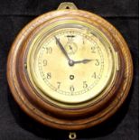Oak cased brass faced wall clock, not working at lotting, overall D: 27 cm. P&P Group 3 (£25+VAT for