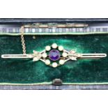 9ct gold amethyst and seed pearl bar brooch in a velvet lined leather box. P&P Group 1 (£14+VAT