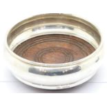 Elizabeth II hallmarked silver bottle coaster, with turned oak and green felt base. Birmingham assay