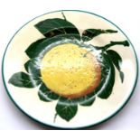Small Wemyss Orange plate for T Goode & Co, London, D: 14 cm. P&P Group 1 (£14+VAT for the first lot