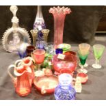 Quantity of antique coloured glassware including Cranberry and silver rimmed scent bottles.
