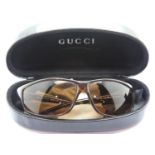 Pair of Gucci sunglasses with tortoiseshell style frames, boxed. P&P Group 1 (£14+VAT for the
