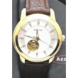Gents Accurist Visual Escapement wristwatch on a leather strap. P&P Group 1 (£14+VAT for the first