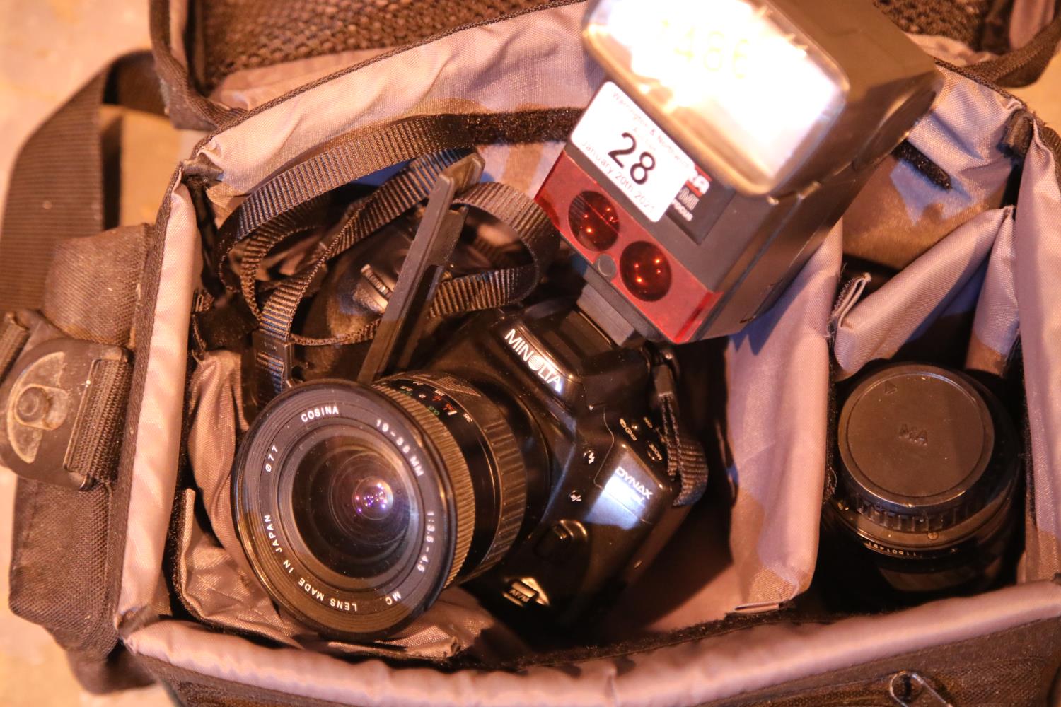 Case holder containing a Minolta Dynax 500 51 camera, a Cobra 700AF-M-1 auto focus flash unit and