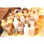 Quantity of antique glass and earthenware bottles, many with impressed names. Not available for in-