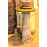 Stoneware garden feature in the form of a tree base and a stoneware bird bath to the upper