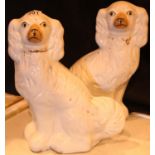 Pair of white glazed Staffordshire dog figurines, H: 35 cm. Not available for in-house P&P,