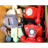 Box of untested GPO retro telephones in red, black, green, grey and ivory, unboxed. Not available