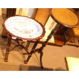 Reproduction mahogany plant stand and a reproduction mahogany ceramic plate top table. Not available