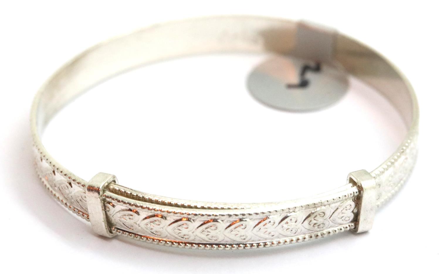 Silver vintage heart engraved adjustable baby bangle, stamped 925. P&P Group 1 (£14+VAT for the