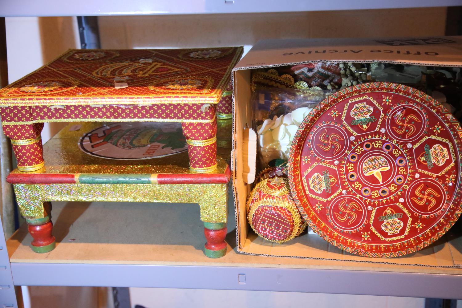 Two decorative prayer type stools and a box of decorative accessories. Not available for in-house