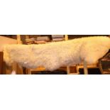 Sheepskin rug, 180 x 60 cm. P&P Group 2 (£18+VAT for the first lot and £3+VAT for subsequent lots)