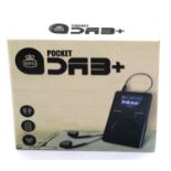 Pocket DAB+ radio with earphones, inbuilt rechargeable battery and an auto adjusting clock, boxed.