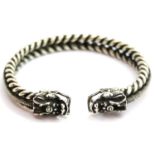 White metal Tibetan silver twisted rope effect bangle with dragon head finials. P&P Group 1 (£14+VAT