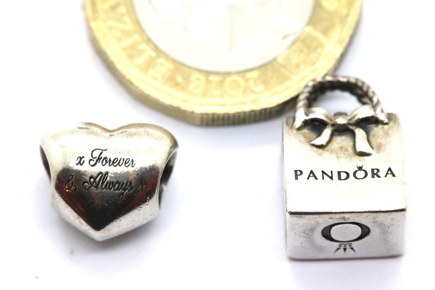 Two genuine Pandora sterling silver charms stamped ALE. P&P Group 1 (£14+VAT for the first lot