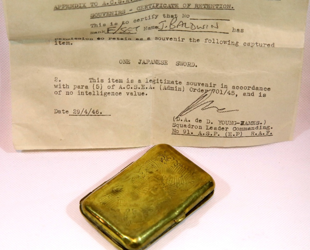 Japanese 1946 dated sword official souvenir retention certificate and a Japanese brass cigarette