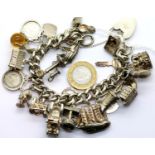 Heavy silver 21 charm bracelet, L: 20 cm, 116g. P&P Group 1 (£14+VAT for the first lot and £1+VAT