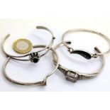 Four silver bangles, combined 51g. P&P Group 1 (£14+VAT for the first lot and £1+VAT for