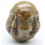 Brass four face Buddha head with seal mark to the base, H: 7 cm. P&P Group 1 (£14+VAT for the