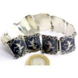 Siam niello sterling silver panel bracelet, 19g. P&P Group 1 (£14+VAT for the first lot and £1+VAT