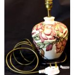 Moorcroft cream ground lamp base, H: 28 cm. P&P Group 3 (£25+VAT for the first lot and £5+VAT for