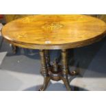 Inlaid walnut loo table on five turned supports to a quatrefoil footed base, 88 x 51 x 72 cm. Not