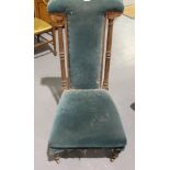 Walnut framed green velvet upholstered prayer chair with fluted legs and supports. Not available for