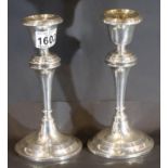 Pair of hallmarked silver weighted candlesticks, Birmingham assay 1912 by William Aitkin, H: 20