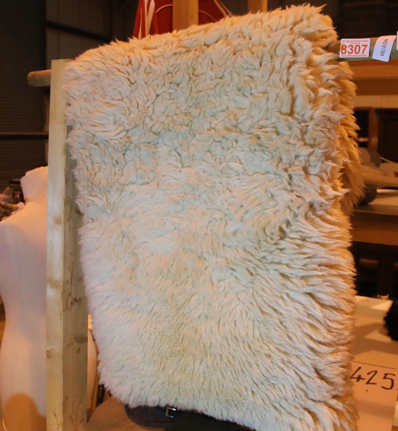 Sheepskin rug, L: 95 cm. Not available for in-house P&P, contact Paul O'Hea at Mailboxes on 01925