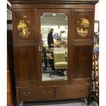 1920s mahogany single door mirrored wardrobe, having two short drawers to the base and two oval