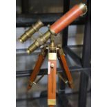 Brass and leather telescope on wooden stand, L: 24 cm. P&P Group 3 (£25+VAT for the first lot and £