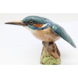 A Beswick figure of a perched Kingfisher. H:12cm P&P Group 2 (£18+VAT for the first lot and £3+VAT