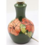 Small Coral ground Moorcroft Hibiscus lamp, H: 20 cm. P&P Group 2 (£18+VAT for the first lot and £