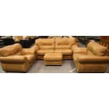 Substantial tan leather three piece suite, comprising three seat sofa and two armchairs with pouffe,