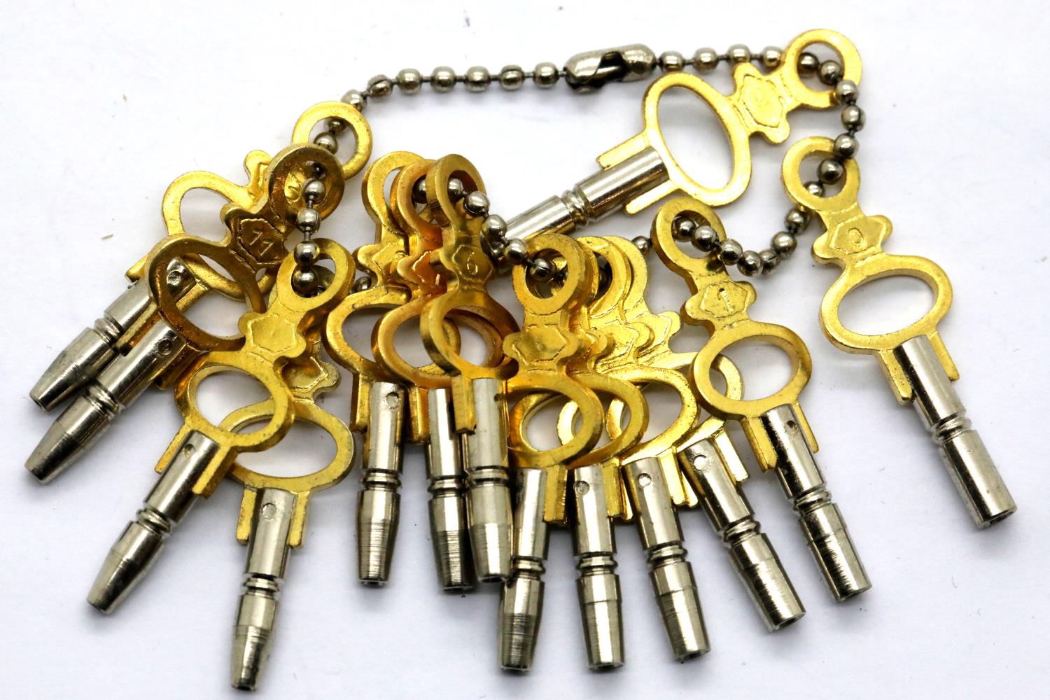 New old stock collection of 14 different sized pocket watch keys. P&P Group 1 (£14+VAT for the first