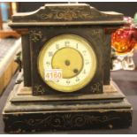Cast iron cased mantel clock with lion mask handles and pendulum. P&P Group 3 (£25+VAT for the first