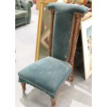 Walnut framed Victorian green velvet upholstered prayer chair with fluted legs and supports. Not