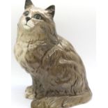 A Beswick figure of a seated cat. H: 22cm P&P Group 2 (£18+VAT for the first lot and £3+VAT for
