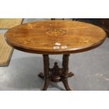 Inlaid walnut loo table on five turned supports to a quatrefoil footed base, 88 x 51 x 72 cm. Not